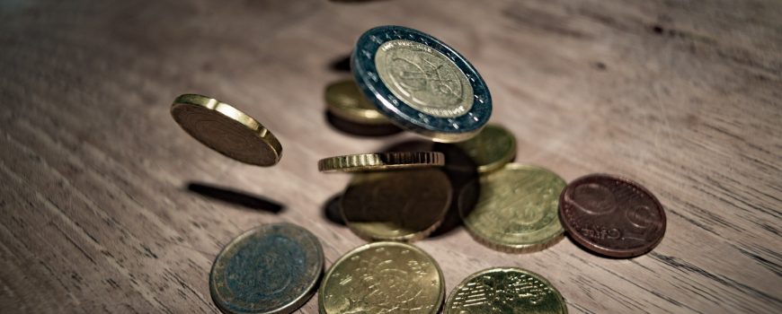 close-up-of-coins-on-table-332304