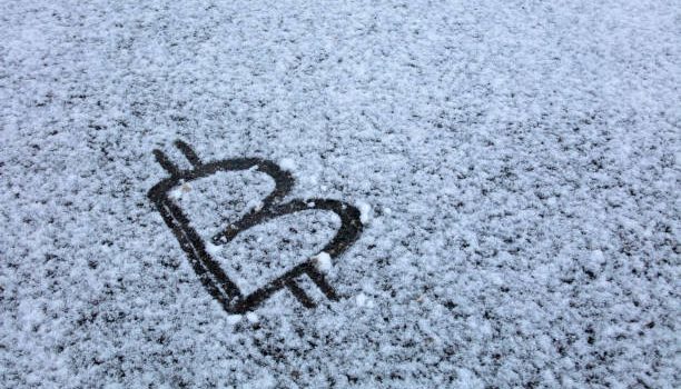 Bitcoin Sign on snow Bitcoin Sign on snow
